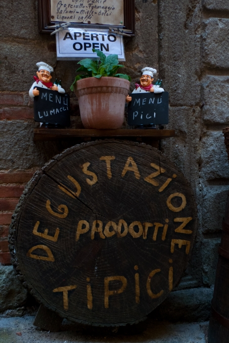 Sign outside a restaurant in Toscana