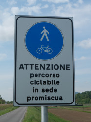 Warning sign — cycle route used by motor vehicles