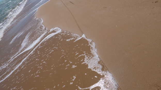 Tyre tracks on the Maganuco beach near Pozzallo