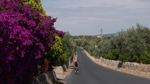 Cyclist on the road between Noto and Avola
