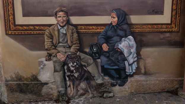 Mural in Sennariolo - Artist: Pina Monne. Note the real leather boots.