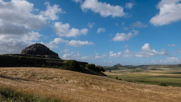 The remains of ancient Barumini with the Castello di Las Plassas in the distance