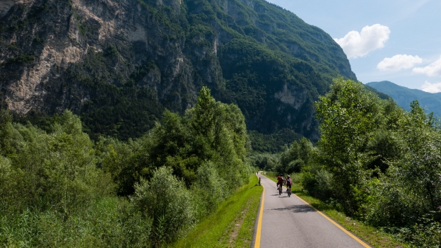 Cyclists on the Valsugana cycleway near Grigno