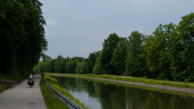 cyclist riding along the Isarkanal - part of the München-Venezia cycle route