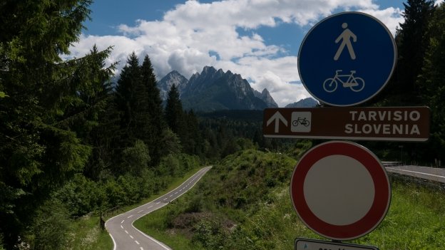 Cycle route signs on the Ciclovia Alpe Adria Radweg (FVG1) near Coccau