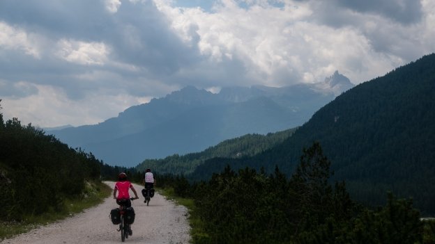 Cyclists on the Ciclabile delle Dolomiti north of Cortina d'Ampezzo